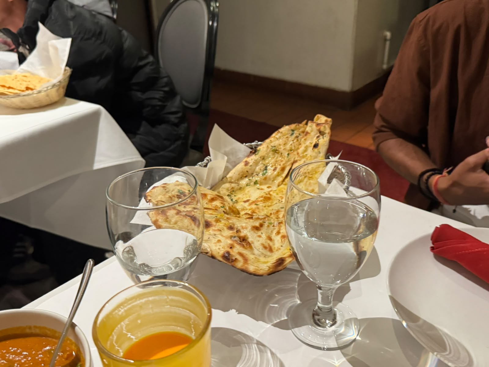 Naan and curry dinner table
